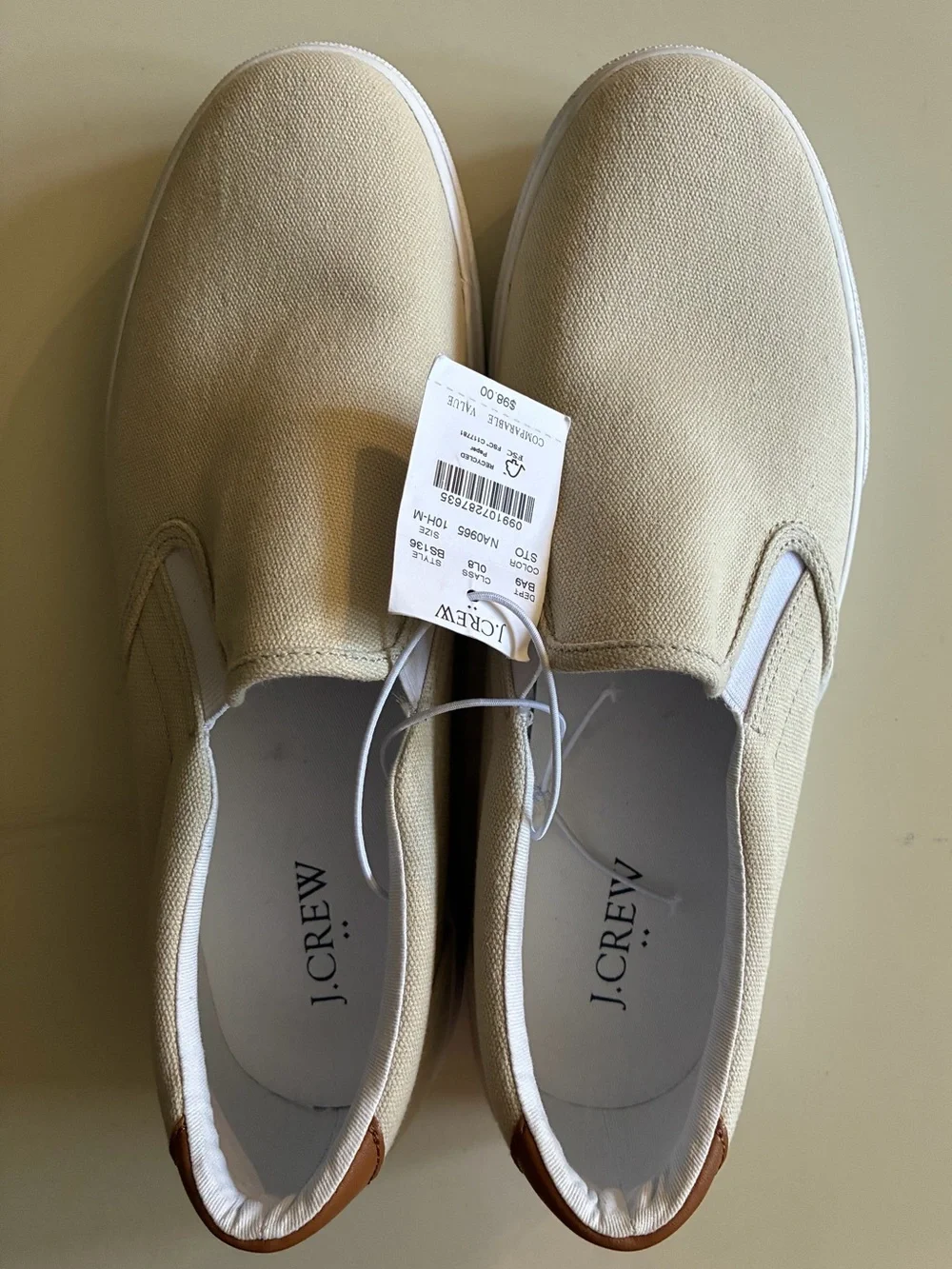 J. Crew Men's Slip-On Canvas Loafers in Light Beige with dust stain on inside.